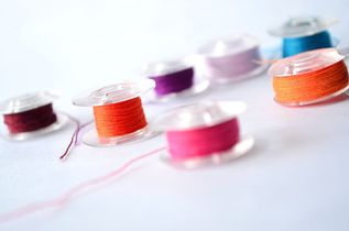 red-blue-and-pink-thread-spool.jpg
